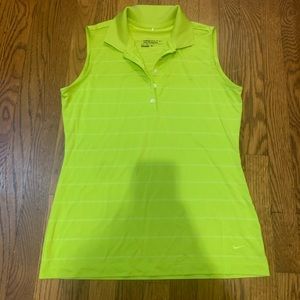 Look cute on the golf course in this line green Nike tour performance shirt.